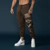 Pantaloni da uomo Autunno Pantaloni sportivi da uomo Sport Tempo libero Fitness Allenamento Leggings Pantaloni Tendenze da uomo Modello di moda Stampa Slim Streetwear 230104