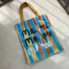 Bolsos de hombro 2023 Diseñador nueva súper capacidad bolsa de lona personalizada estudiante duradero carta de compras graffiti color mano a juego