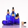 Blauw Glas Etherische Olie Serum Parfumflesjes Met Pipet Houtnerf Cap Voor Vloeibare Cosmetische 5 Ml 10 Ml 30 Ml 50 Ml 100 Ml