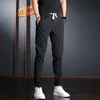 Pantaloni da uomo Estate Uomo Elastico in vita Casual Coreano Streetwear Pantaloni slim fit in cotone leggero grigio