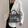 Sommer 2023 transparente Jelly -Tasche große Kapazität Frauen Neue Mode -Handheld -Tasche vielseitig ein Schulterkreuzkörper