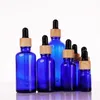 Blue Glass Essential Oil Serum Parfum flessen met oogdruppel houten korrelkap voor vloeibare cosmetische 5 ml 10 ml 30 ml 50 ml 100 ml