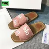 Designertofflor för damer Paris COE Woody Flat Mule Slide Sandaler Segel Svart vit oliv beige röd mesh broderad präglad linne rosa mode strand dam rutschbanor