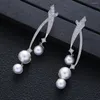 Pendientes colgantes, pendiente cruzado de perlas a la moda para mujer, fiesta de boda, joyería nupcial de Dubái, Boucle D'oreille, regalo para mujer E19388