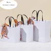 Kraft Paper Shopping Jewelry Boxes Wedding Party Favor Merchandise Retail Sacks Black Paper Gift Bags with Handles Bulk