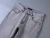 Mens Designer Straight Leg Jeans för en mängd olika scenarier Triangulära dekoration Nya nödställda vattendiamantränder Size 29-40 Business Casual Light Jean