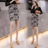 Gonne Estate Corta da donna Elegante Casual Vita alta Stampata Anca avvolta in cotone di nylon Minigonna Abbigliamento moda coreana A109