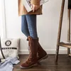 Femmes bottes hautes hiver longues manches chaudes extensibles bretelles croisées bottes hautes givrées avec talon bas.