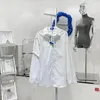 Mäns casual skjortor ader 2023 överdimensionerad adererror skjorta målar hög gata män kvinnor fout v form blus vit fast färg bomull