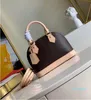 Bolsos de hombro Luxurys Designers Mini Shell bolsos CrossBody Bag Fashion Women Leather High Quality Old Flower Bolso