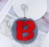 Keychains lanyards 26 Alfabet sleutelringen kunstmatige konijnenbont ball hanger zacht en pluche pompom letters keyfobs sieraden drop del dhpmh