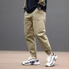 メンズジーンズストリートファッショングレービッグポケットスプライスデザイナーカジュアルカーゴパンツHOMBRE HIP HOP JOGGERSルーズフィットハーレムズボン230113