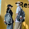 Skolväskor kamouflage mode kvinnors ryggsäck sommarväska för flickor pojkar nylon skolväska lätta resor ryggsäckar 2023