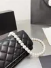 Pearl Chain Fashion Designer Bag Women Luxury Bag Handbag Crossbody Bag Clamshell Design Classic Ringer M￶nster Kopplingsv￤ska