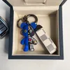 مصمم سلاسل المفاتيح Luxurys Keychain جلدية Little Bear Design Fashion نمط غير رسمي سلسلة مفاتيح مزاجه متعددة الاستخدامات شعبية حقيبة معلقة جراب هاتف لطيف للغاية