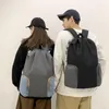 Skolväskor ryggsäck för mäns och kvinnors stora kapacitet resedator fritid trend junior hög elevernas skolväskor