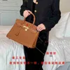 Designer Bags Handbags Togo Leather Platinum Bag Litchi Pattern Fashion Versatile Womens Buckle Hand 25303540cm Bn1q