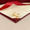 Projektantki kolczyki stadninu biżuteria Diamentowa cyrkonia sześcienna cZ dla męskich damskich luksus 18K żółte złoto stali nierdzewne biżuterie tytanowe róże srebrne gds