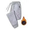 Calça masculina Sorto de moletom casual Homens de lã quente de algodão da moda à prova de água da água solta engano correr calças