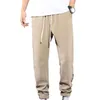 Męskie spodnie Stylowe mężczyźni spodnie dresowe z pasmką głębokiego krocza czystego koloru spodni Multi Pockets Ubrania