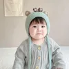 Berretti Infantile Autunno Inverno Cute Baby Bear Protezione per le orecchie Fodera in cotone Paraorecchie Cappello peruviano Fiocco lavorato a maglia Cappuccio antivento con maniche calde