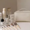 Cosmetische tassen badkamer reiskit toilethalige multifunctionele waterdichte draagbare handtas make-up vrouwen waszagzak groot capaciteit leer