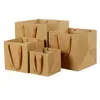 Verpackungstaschen Braune Kraftblumen-Papier-Quadrattasche mit Griff auf Lager Drop-Lieferung Büro Schule Geschäft Industrie Dhrvi