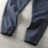 Pantaloni da uomo Pantaloni sportivi cargo multitasche versatili da uomo in tessuto invernale antivento in pile da esterno ispessito