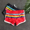 Mäns badkläder split shorts med kopp män tredimensionell fickman sportboxare korta mode baddräkter