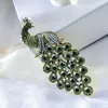 Broches mannen vrouwen luxe voortreffelijk kristal zirkoon elegante high -end pauw broche banket jurk accessoires charme sieraden cadeau