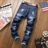 Heren jeans heren jeugd slanke broek rechte broek stretch geborduurd gat mode tijger blauw zwart 2 kleur