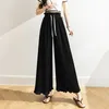 Kvinnors byxor capris kvinnlig koreansk modekvinna culottes kvinnor bandage veckad bred ben byxa sexig byxa kjol bottnar 2women's