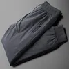 Męskie spodnie Minglu Down męskie luksusowy stały kolor elastyczny talia zima szczupły dopasowanie proste męskie spodnie plus rozmiar 4xl