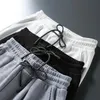 Мужские брюки Jrbuihz весенние осенние спортивные штаны мужчины белая серая широко широко раскрытая выставка Sutshirt сдерживается повседневная мешковатая мешкова