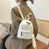 Sac à dos Mini peluche couleur unie pour femmes, petites filles, mode sauvage, doux, automne hiver, élégant, petit sac à dos pour la rue commerçante