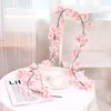 Dekorativa blommor 1.8Metrar konstgjord blommsträng med blad Silk Sakura Cherry Blossom Ivy Vine For Wedding Arch Home Garden Decor