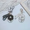 Koreansk version pärlsnöre berg kamelia nyckelringar fashionabla personlighet väska hänge dam bil nyckelring hänge