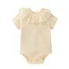 2023 Summer Short Sleeve Solid Color Ruffle Jumpsuit Nyfödd baby stickade rompers 100% bomull onesie