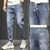 Pantalon masculin printemps et été bleu noir jeans jeans street jogging jogging denim lâche harem plus taille de taille pour hommes