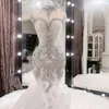 2023 Luxurious Mermaid Wedding Dresses Arabic Silver Crystals Beaded High Neck Illusion Ruffles Tiered Bridal Dresses Cap Sleeves Bridal Gowns Hollow Back