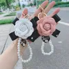 Keychains Fashion Bow Rose Keychain Creative Trend Pearl hanger Charm Girl Cute Fun Bag mobiele telefoon