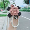 Keychains Fashion Bow Rose Keychain Creative Trend Pearl hanger Charm Girl Cute Fun Bag mobiele telefoon