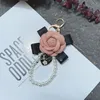 Keychains Fashion Bow Rose Keychain Creative Trend Pearl hanger Charm Girl Cute Fun Bag mobiele telefoon