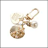 Anahtar halkalar kız için sevimli inci kabuğu yaratıcı küçük hediyeler ins metal mücevher kolye anahtar zincir bayanlar moda aksesuarları down dağıtım otpgs
