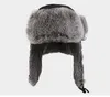 Berretti di alta qualità da uomo in vera pelliccia cappelli invernali con paraorecchie all'aperto berretti da neve caldi cappello russo berretto bomber per le donne W00256