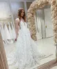 Abiti da sposa a-line in pizzo con scollo a V Boho 2023 Appliques in pizzo senza schienale senza maniche Abito da sposa lungo in raso con spacco sul davanti Sexy sposa di campagna Vestido De Novia