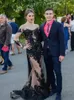 Sexy Black Mermaid Evening Dress Illusion Tulle with Floral Applique Long Sleeves Zipper with Butfons Back Prom Gowns