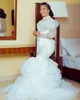 2023 Sexy Luxury Mermaid Wedding Dresses African High Neck Illusion Lace Appliques Crystal Beading Long Sleeves Vestidos De Novia Bridal Gowns Ruffles Tiered