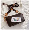 Bolso de mujer Nuevo bolso de diseñador Bolso de mensajero de hombro estampado a la moda Bolso de cadena Albóndigas de un solo hombro a la moda