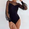 Kvinnors jumpsuits rompers sexiga se genom pärlor bodysuits kvinnor mesh lapptäcke långärmad svart klubbparti elegant mode leotard grundläggande toppar 230131